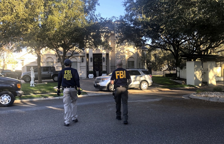 Image: Federal agents search the home of U.S. Rep. Henry Cuellar in Laredo, Texas, on Jan. 19, 2022.