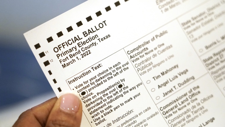 Pam Gaskin holds her mail-in ballot. 