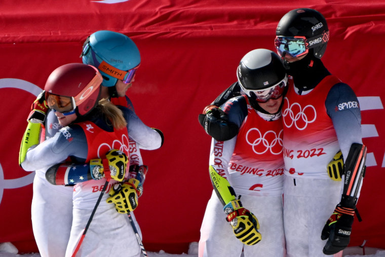 From left, Team USA's Mikaela Shiffrin, River Radamus, Paula Moltzan and Tommy Ford react after the mixed team parallel small final during the 2022 Beijing 2022 Winter Olympics on Sunday.