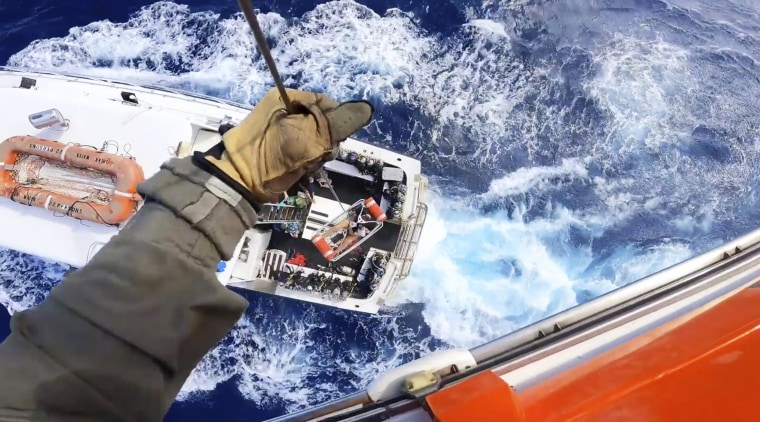 A U.S. Coast Guard helicopter crew rescues a man after he was bitten by a shark while fishing aboard a vessel near Bimini, Bahamas, on Feb. 21, 2022.