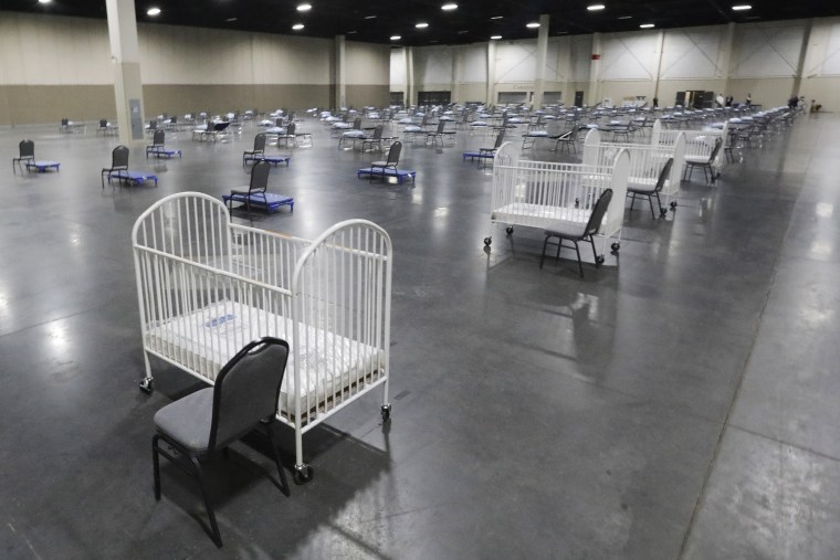 Cots and cribs are arranged at the Mountain America Expo Center in Sandy, Utah, on April 6, 2020, as an alternate care site or for hospital overflow during the  pandemic.