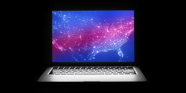 Photo Illustration: A map of the United States lights up a dark laptop screen