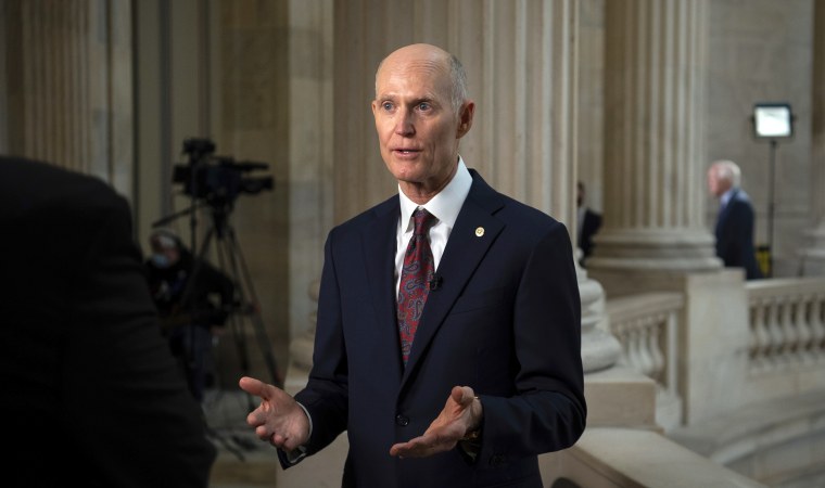 Sen. Rick Scott speaks to media during a television interview at the U.S. Capitol, in Washington, on Jan. 19, 2022.