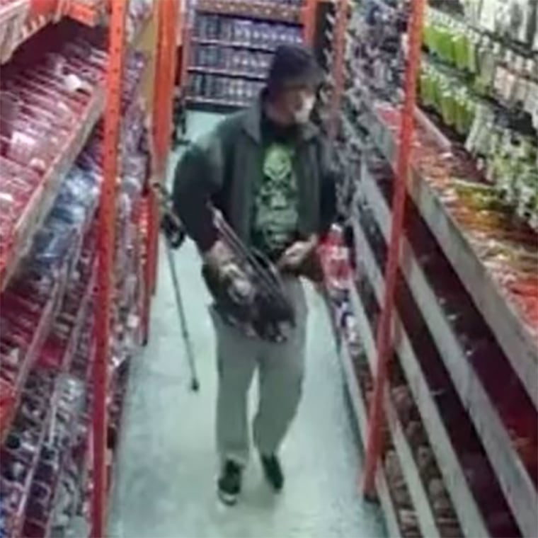 A man walks with a crossbow that he is then caught stealing.