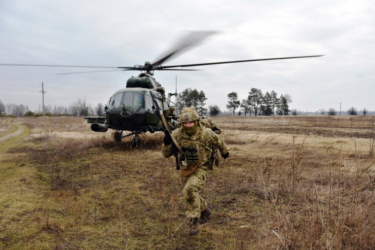 Image: Service members of the Ukrainian Air Assault Forces take part in tactical drills at a training ground in an unknown location in Ukraine, in a photo released on Feb. 18, 2022.