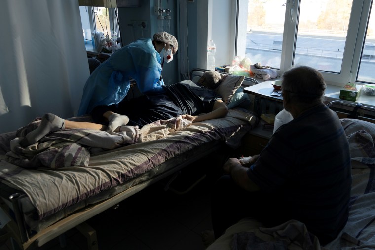 Image: A medical specialist treats a patient suffering from Covid-19 at the intensive care unit of the City Clinical Hospital Number 3 in Kyiv, Ukraine, on Oct. 26, 2021.