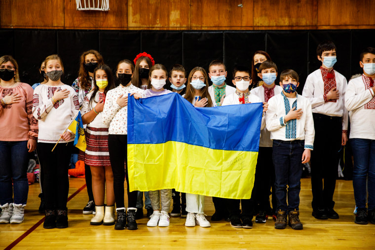 Students sing the Ukrainian national anthem during an assembly about the crisis in Ukraine at Self-Reliance School of Ukrainian Studies in New York on Feb. 26, 2022.