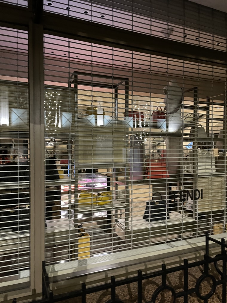 An after-hours photo of the window of the department store I used to look through to spot my friend and make her smile. 