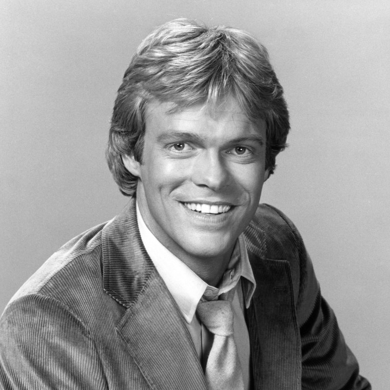A young white man named Morgan Stevens in black and white in a corduroy jacket, white shirt and tie.