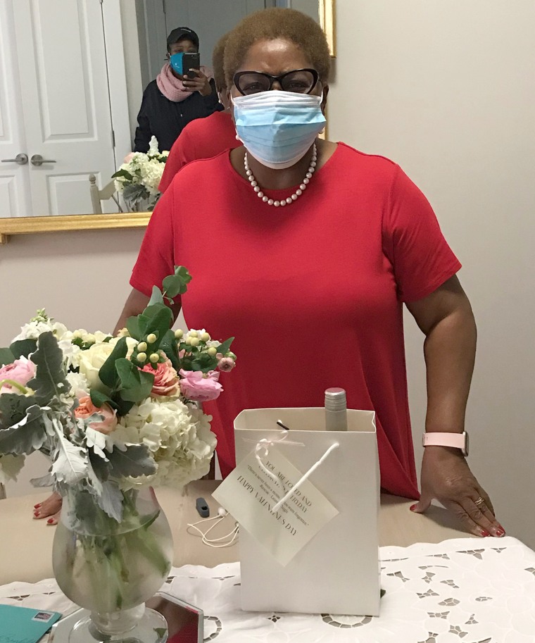 One of the widows honored in 2021 poses with her bouquet and gift bag.