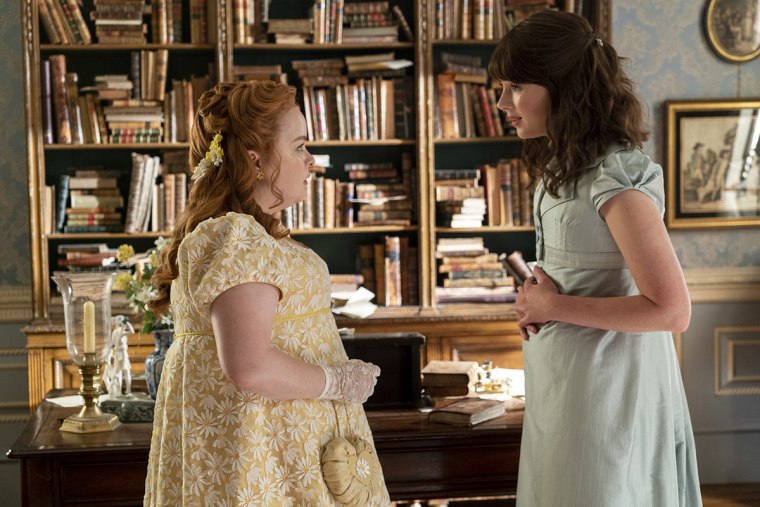 Penelope Feathingerton (Nicola Coughlan) talks with her best friend Eloise Bridgerton (Claudia Jessie) in "Bridgerton."