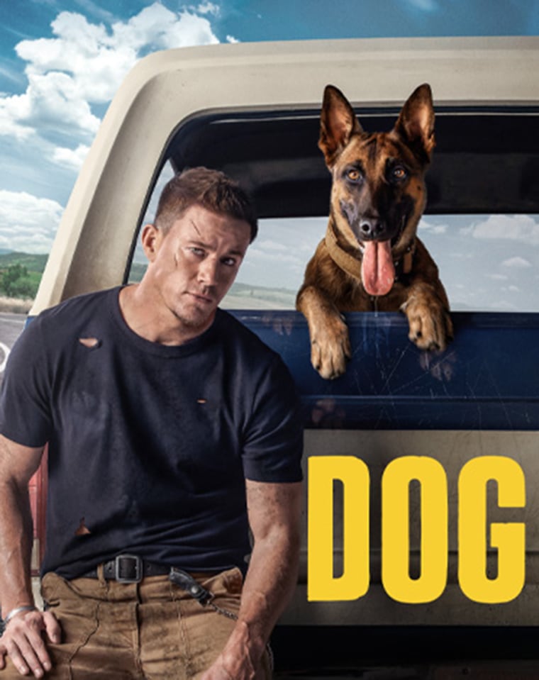 Channing Tatum leans against a pick up truck with a dog popping it's head out of the back over the ledge.