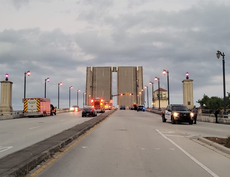 A bicyclist fell to her death in Florida when a drawbridge connecting West Palm Beach and Palm Beach opened as she was walking her bike across it, authorities said.