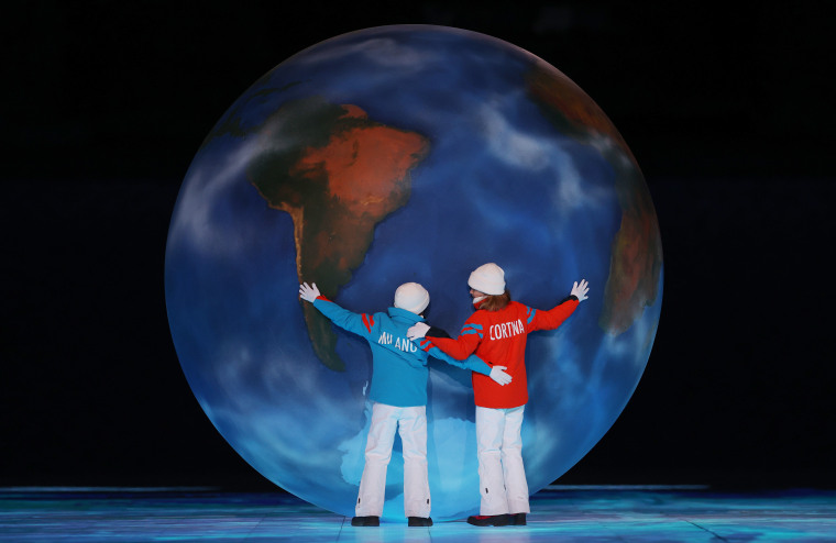 Children representing Milan and Cortina hold a globe as part of the handover ceremony during the Beijing 2022 Winter Olympics Closing Ceremony on Day 16 of the Beijing 2022 Winter Olympics at Beijing National Stadium on February 20, 2022 in Beijing, China