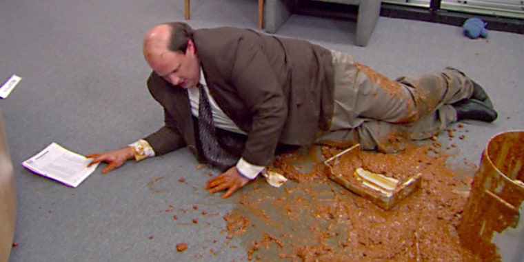 Kevin Malone struggling in the chili Slip 'N Slide of his own creation.