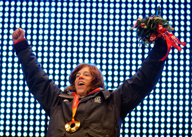 Men's Halfpipe gold medalist Shaun White celebrates his gold medal during the Medal Ceremony on Day 2 of the Turin 2006 Winter Olympic Games  at the Medals Plaza on February 12, 2006 in Turin, Italy.