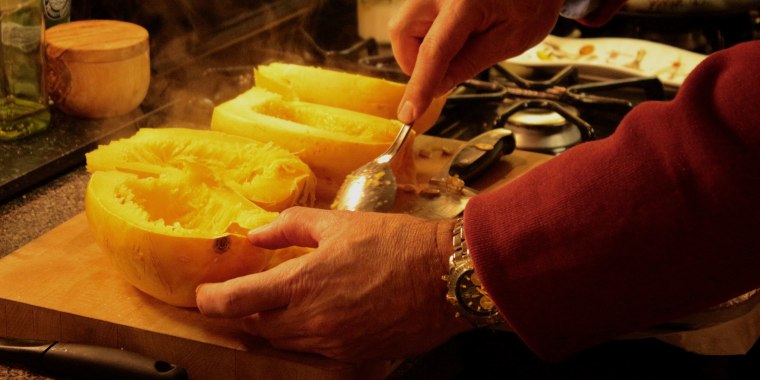 Cropped Image Of Hand Preparing Food In Kitchen