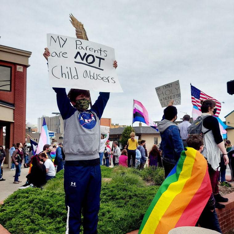 Amber Briggle's son at a protest against legislation that would criminalize care for transgender youth.