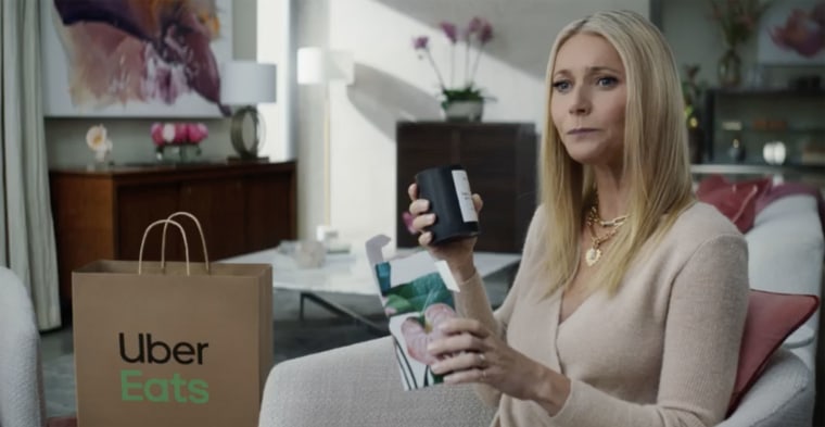 Gwyneth Paltrow's infamous candle makes an appearance in the ad.