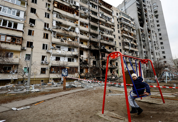 Image: A residential building is damaged, after Russia launched a massive military operation against Ukraine, in Kyiv