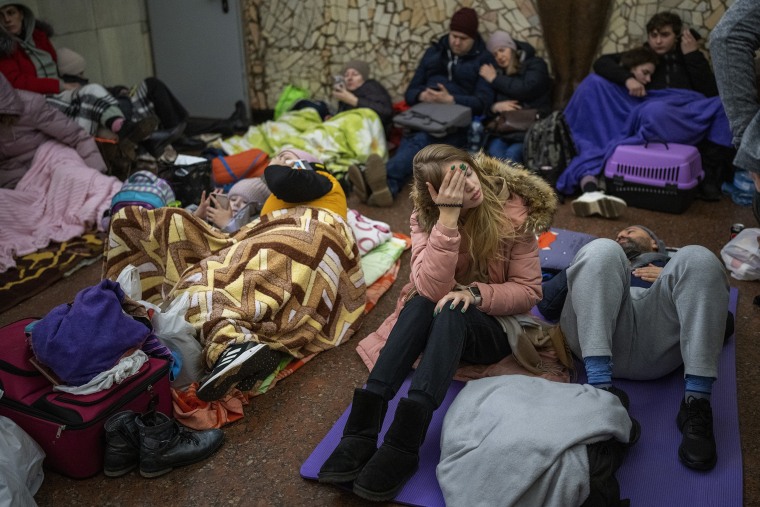 People rest in the Kyiv subway