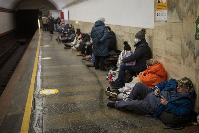 People lie in the Kyiv subway