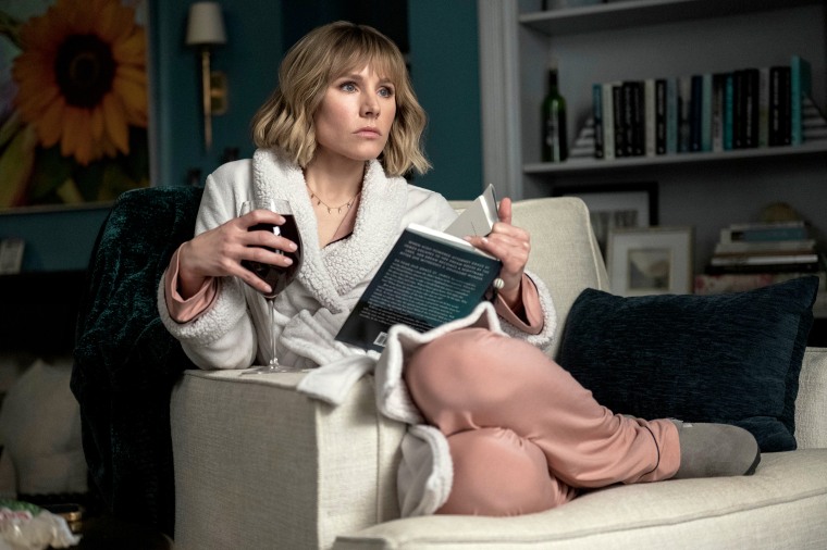 Kristen Bell as Anna, who holds a glass of wine that's actually grape juice, in episode 101 of "The Woman in the House Across the Street From the Girl in the Window."