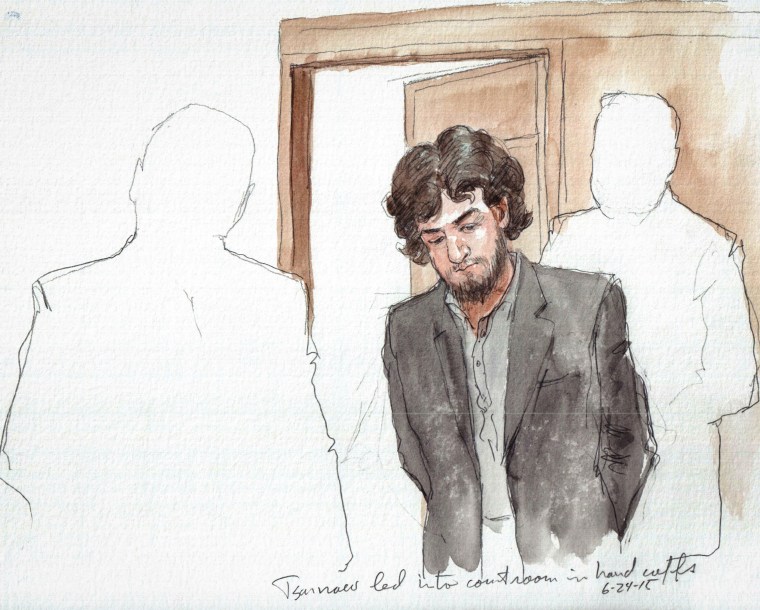 Boston Marathon bomber Dzhokhar Tsarnaev enters the courtroom in handcuffs on June 24, 2015.