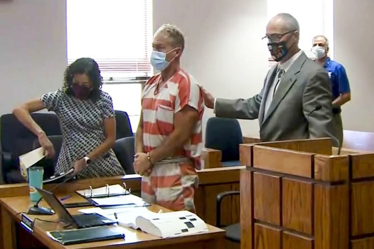 Barry Morphew, center, appears in court in Salida, Colo., on May 6, 2021.