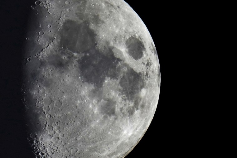 Impact craters cover the surface of the moon, seen from Berlin, Germany, Tuesday, Jan. 11, 2022. The moon is about to get walloped by 3 tons of space junk, a punch that will carve out a crater that could fit several semitractor-trailers. A leftover rocket is expected to smash into the far side of the moon at 5,800 mph (9,300 kph) on Friday, March 4, 2022, away from telescopes’ prying eyes. It may take weeks, even months, to confirm the impact through satellite images.