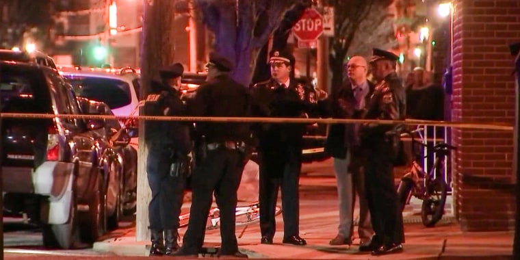 Police investigate a crime scene in South Philadelphia on March 1, 2022.