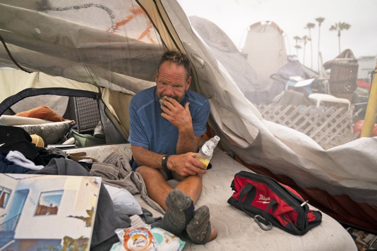 Scott See in his tent at a homeless encampment