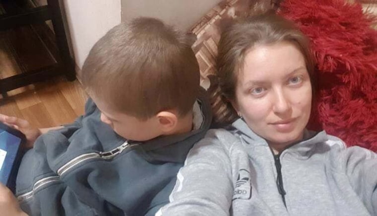 Kherson resident Yulia Verner said she sleeps in the hallway of her Kherson apartment with her son, Andrii.