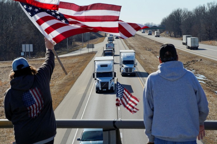 Image: Truckers and their supporters form a convoy bound for the nation's capital