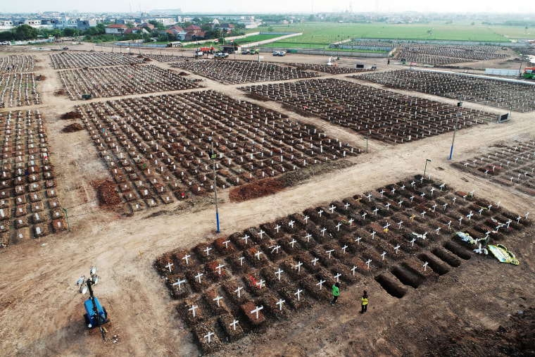 Crosses mark the graves of Covid-19 victims at the Rorotan cemetery in Jakarta, Indonesia, on Aug. 18, 2021.