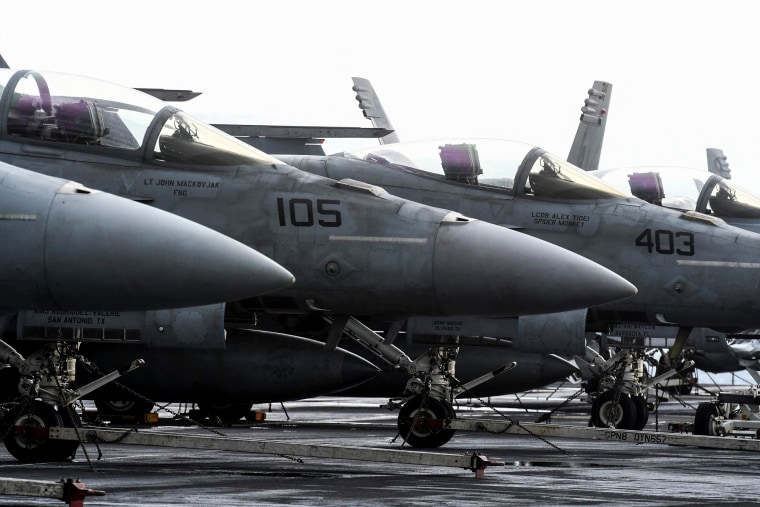 Fighter jets are stationed on the deck of the aircraft carrier USS Harry S. Truman, which arrived on a four-day visit off the city of Split, Croatia, on Feb. 14, 2022.