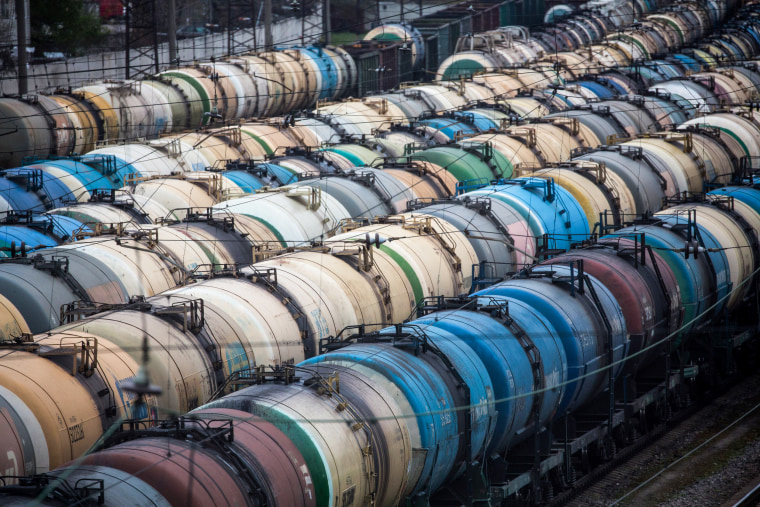 Rail wagons for oil, fuel and liquefied gas cargo stand in sidings at Yanichkino railway station, close to the Gazprom Neft PJSC Moscow refinery in Moscow on April 27, 2020.