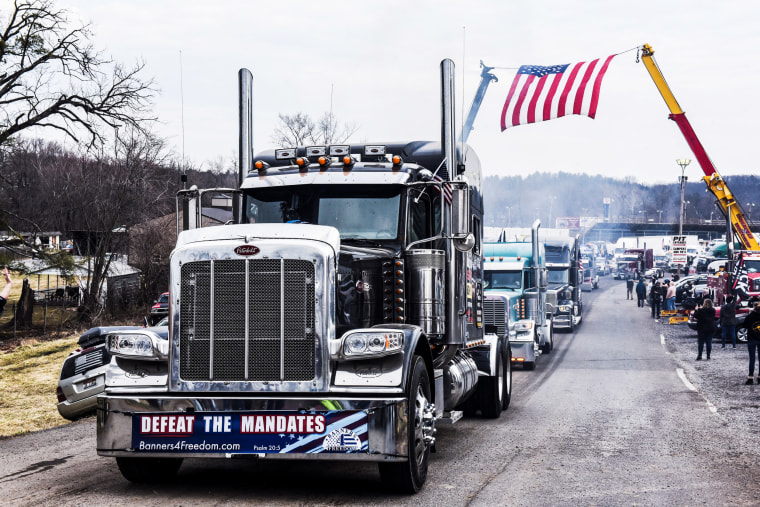 Hundreds of vehicles including 18-wheeler trucks, RVs and other cars depart the Hagerstown Speedway after some of them arrived as part of a convoy that traveled across the country headed to Washington to protest Covid-19 mandates in Hagerstown, Md., on March 6, 2022.