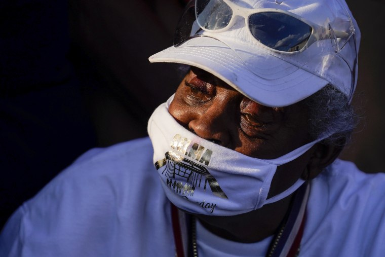 A person waits to hear Vice President Kamala Harris speak near the Edmund Pettus Bridge in Selma, Ala., on the anniversary of "Bloody Sunday," a landmark event of the civil rights movement on Sunday, March 6.