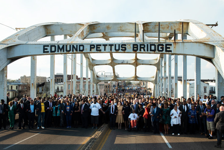 Vice President Kamala Harris, front center, and other participants walk over the Edmund Pettus Bridge during an event marking the 57th anniversary of the 1965 Bloody Sunday civil rights march in Selma, Ala. on Sunday, March 6.