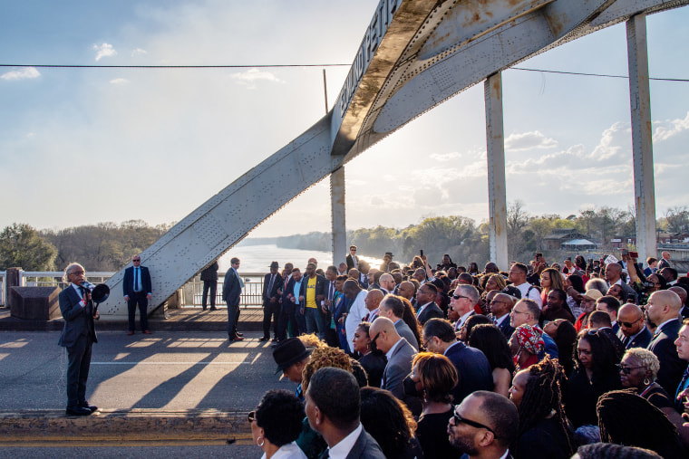 The Rev. Al Sharpton prepares marchers for a prayer on the Edmund Pettus Bridge during commemorations for the 57th anniversary of "Bloody Sunday" on Sunday, March 6 Selma, Ala.