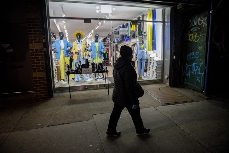 Outfits in the colors of the Ukrainian flag are displayed inside Exclusive Women's Wear in the Brighton Beach neighborhood of Brooklyn, N.Y., on March 4, 2022.