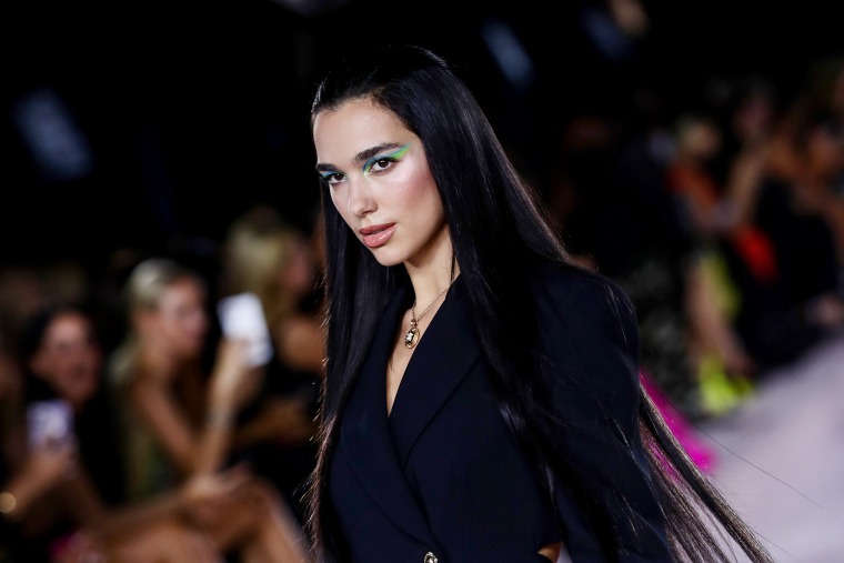 Dua Lipa walks the runway at the Versace fashion show during the Milan Fashion Week on Sept. 24, 2021, in Milan, Italy.