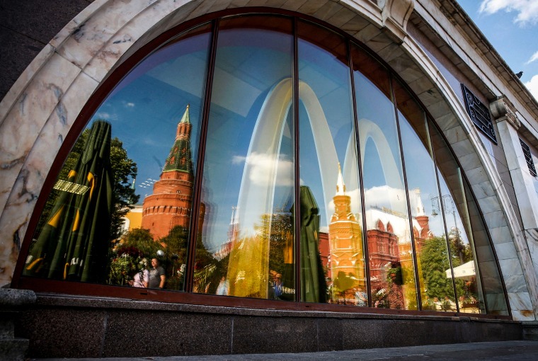 Image: The walls and towers of the Kremlin are reflected in a window of a McDonald's restaurant in Moscow, on Aug. 21, 2014.