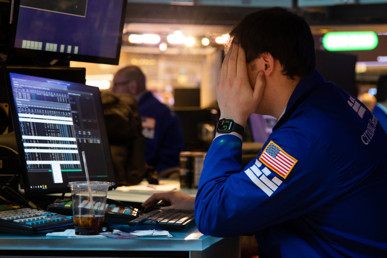 Image: A trader works on the floor of the New York Stock Exchange on Feb. 28, 2022.