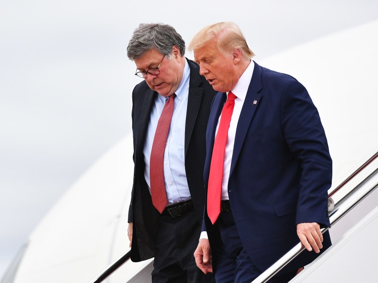 Donald Trump and US Attorney General William Barr exit Air Force One upon arrival at Andrews Air Force Base in Maryland on September 1, 2020.