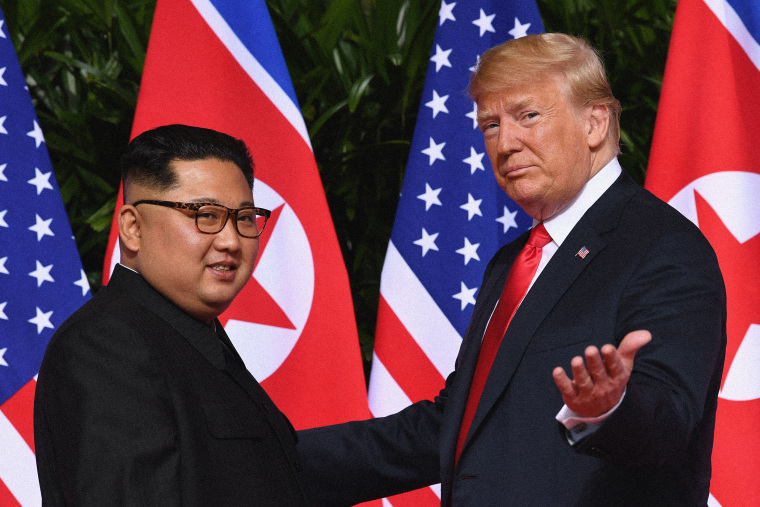 Former president Donald Trump meets with North Korea's leader Kim Jong Un at the start of their historic US-North Korea summit, at the Capella Hotel on Sentosa island in Singapore on June 12, 2018.