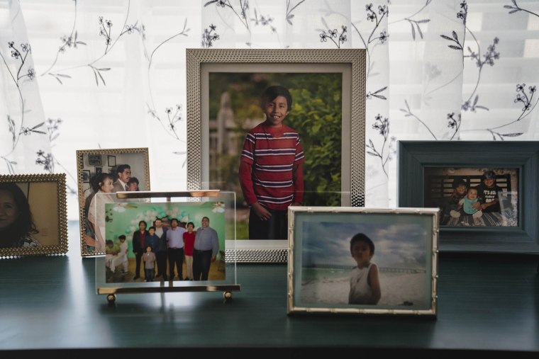A photo of Elliott with other family photos at the new home of the Hernandez family.