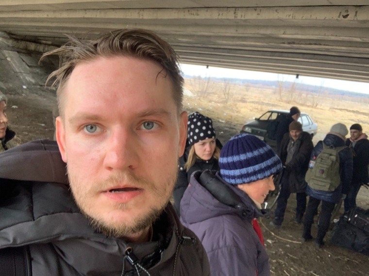The author waited under a bridge for a chance to cross into Kyiv.