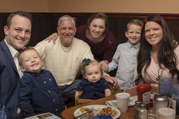 David Bennett Sr., third from left, surrounded by family members in 2019. 